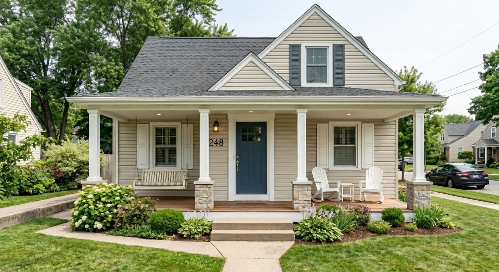 Same house with an AI-added full-width covered front porch on white columns with stone bases, a bench and two chairs